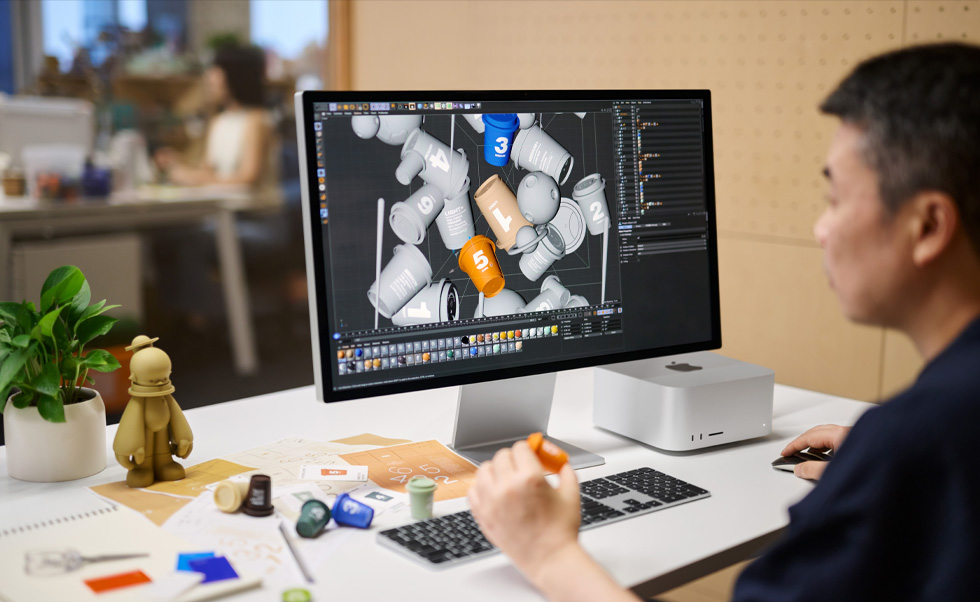 Projektant korzysta z Maca do renderowania grafiki 3D.
